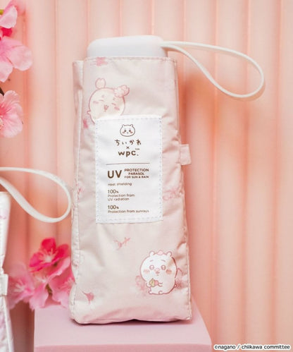 Ombrelle pliable Chiikawa × Wpc. – Parasol kawaii UV 100 %, pliant, pluie & soleil (édition sakura)